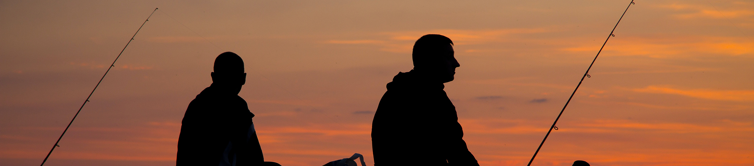 2 men fishing at sunrise on leech lake