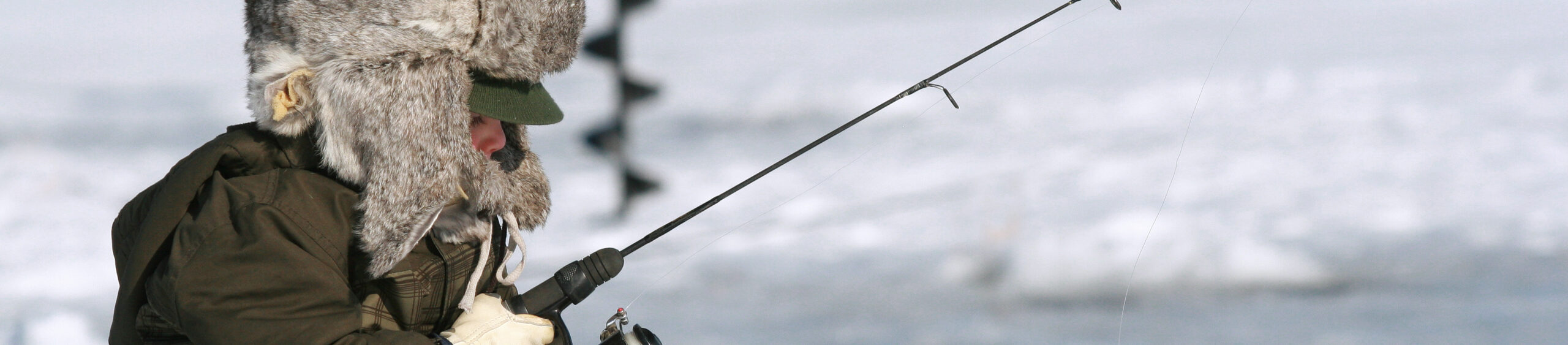 Boy Ice Fishing On Leech Lake