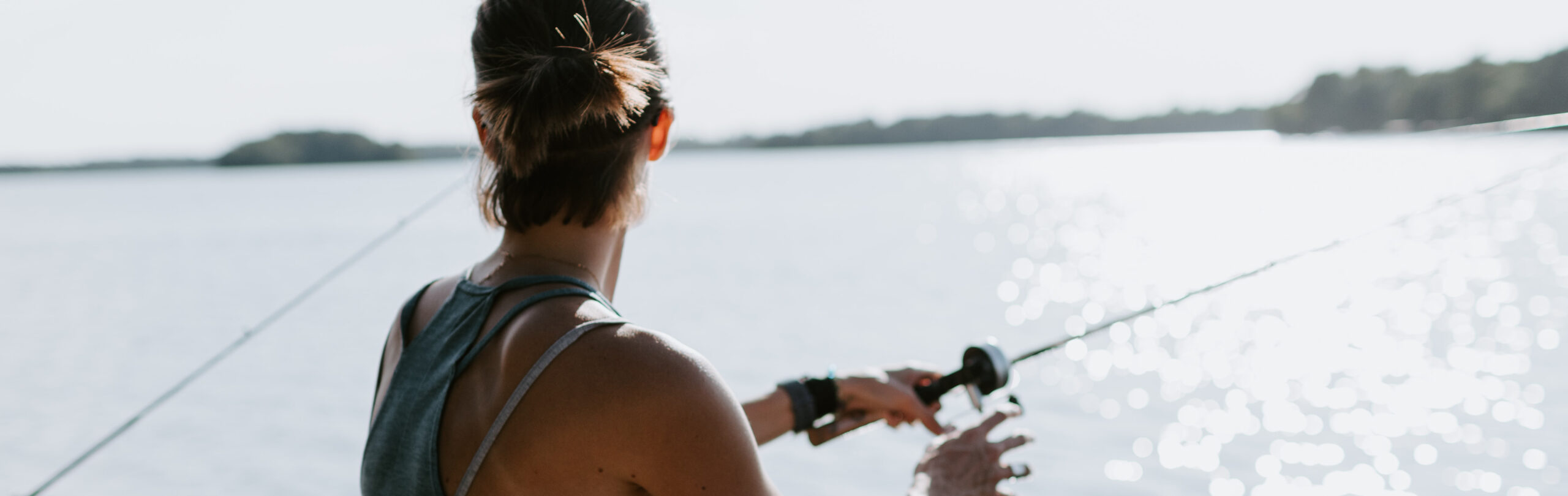 Woman fishing on a lake