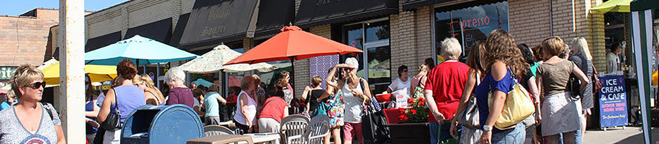 people outside a busy city center in walker