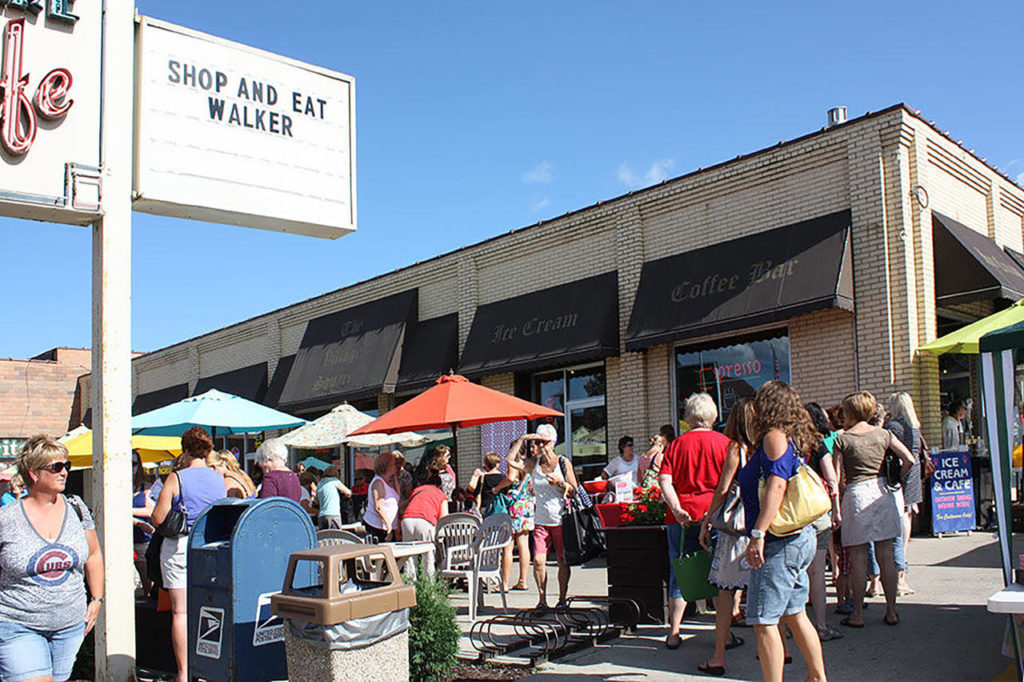 people outside a busy city center in walker