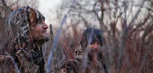 hunters in the woods in winter