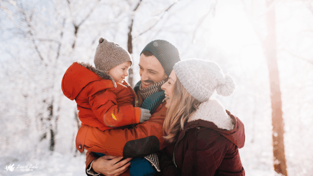 family hugging outside in winter